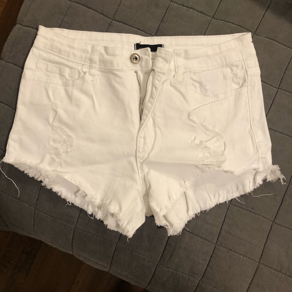 White ripped jean shorts